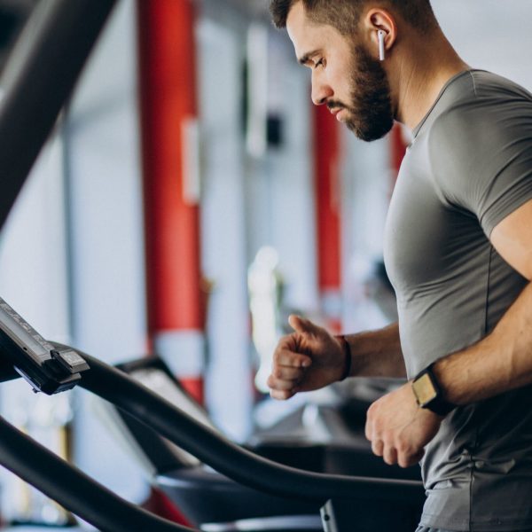 Strong man training in gym